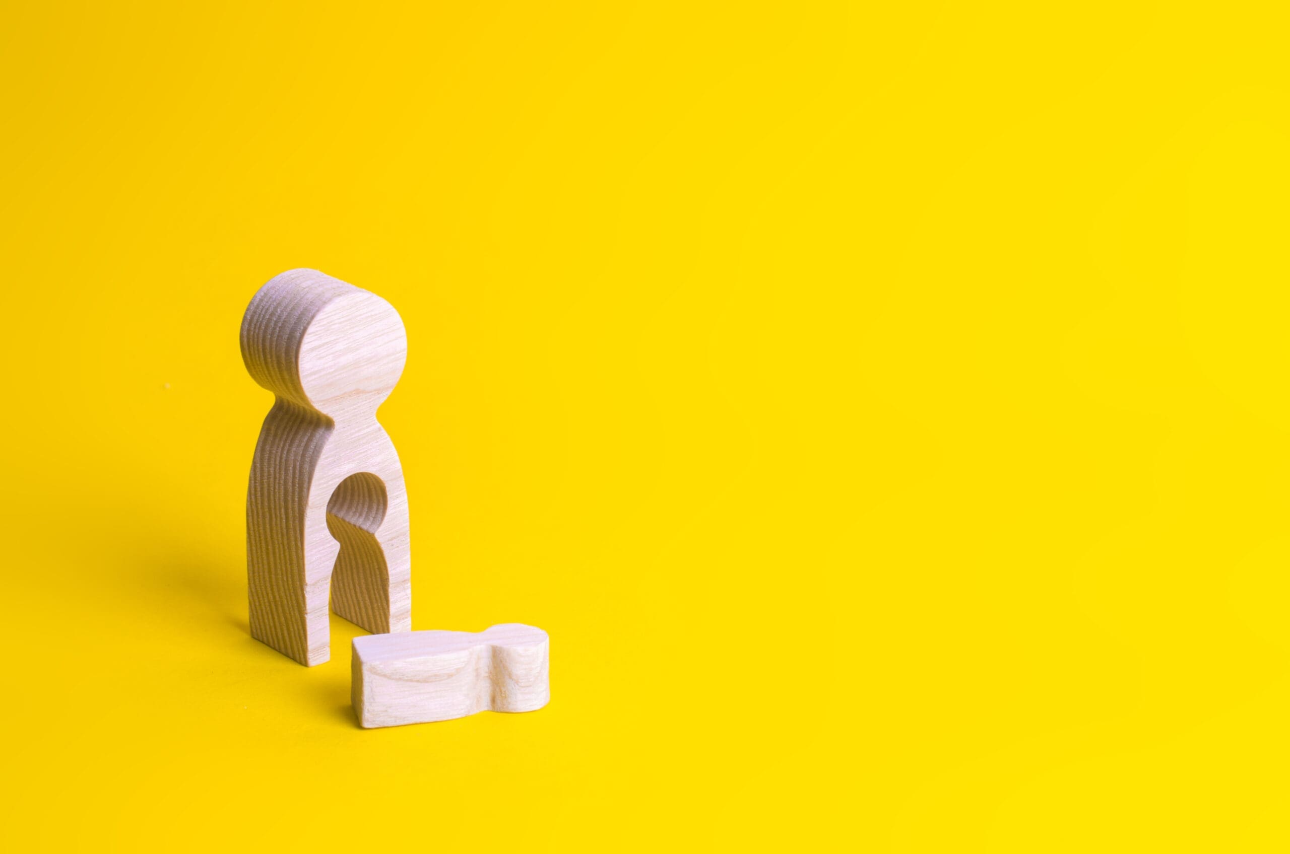 A wooden figure of a woman with a void from which a child fell. The concept of the loss of a child, abortion of pregnancy, miscarriage. mother lost her child. Deprivation of parental rights.