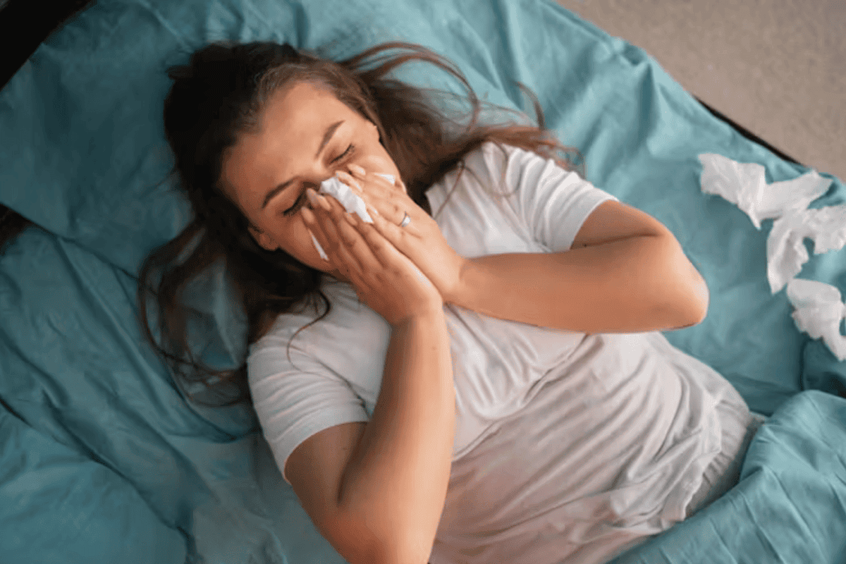 woman blowing her nose